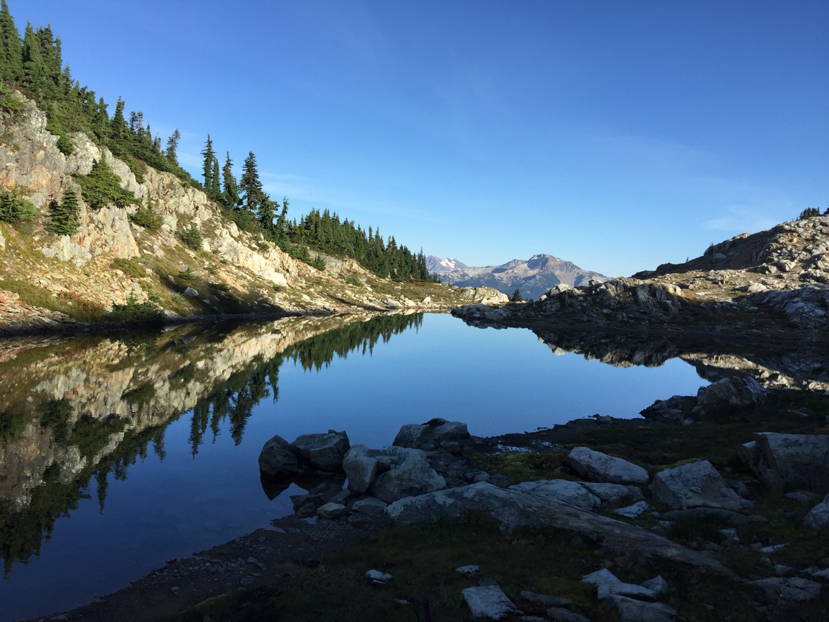 A small high-alpine lake at the summit of Mount Sproatt, Canada